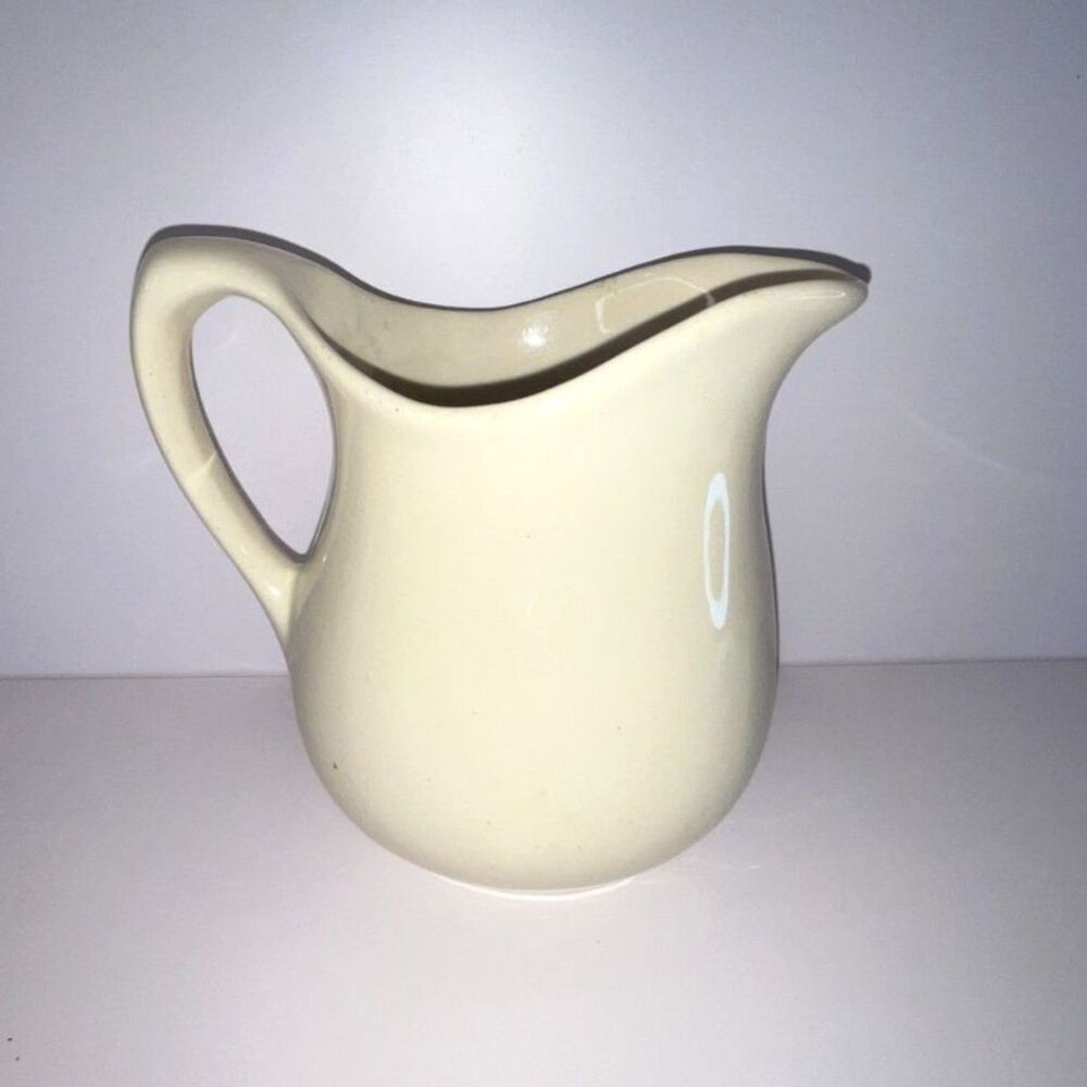 Beautiful vintage white stoneware pitcher; measures 6" x 5" x  3 1/2"